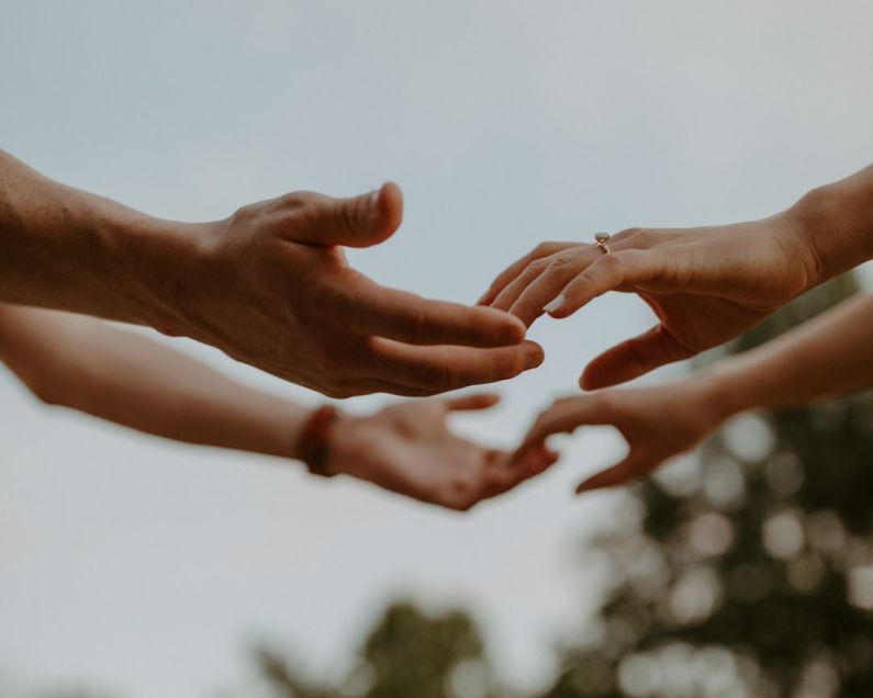Intimacy - a group of people reaching out their hands