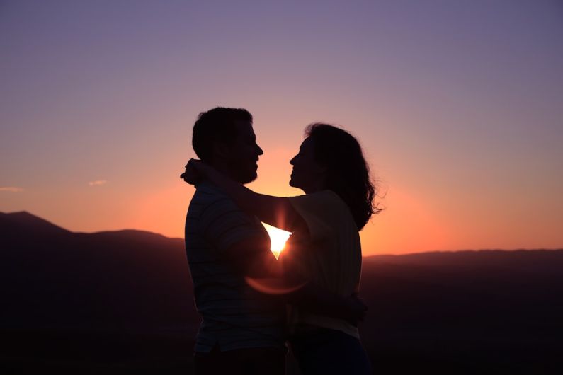 Unhealthy Relationship - silhouette of hugging couple