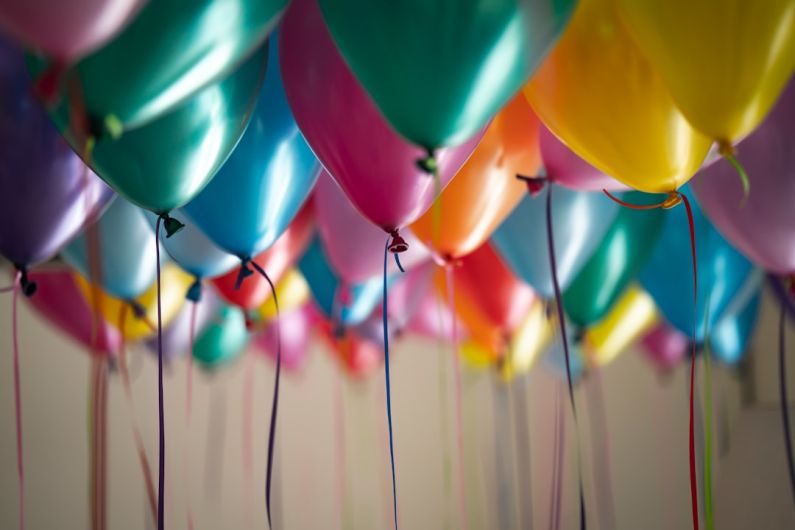 Party - selective focus photography of assorted-color balloons