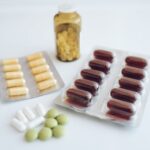 Checkups - a table topped with pills and a bottle of pills