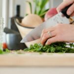 Cooking - person cutting vegetables with knife