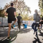 Cardio - man in black t-shirt and black shorts running on road during daytime
