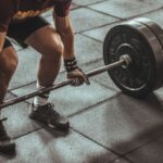 Strength Training - person weightlifting painting