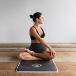 Pilates - woman performing yoga
