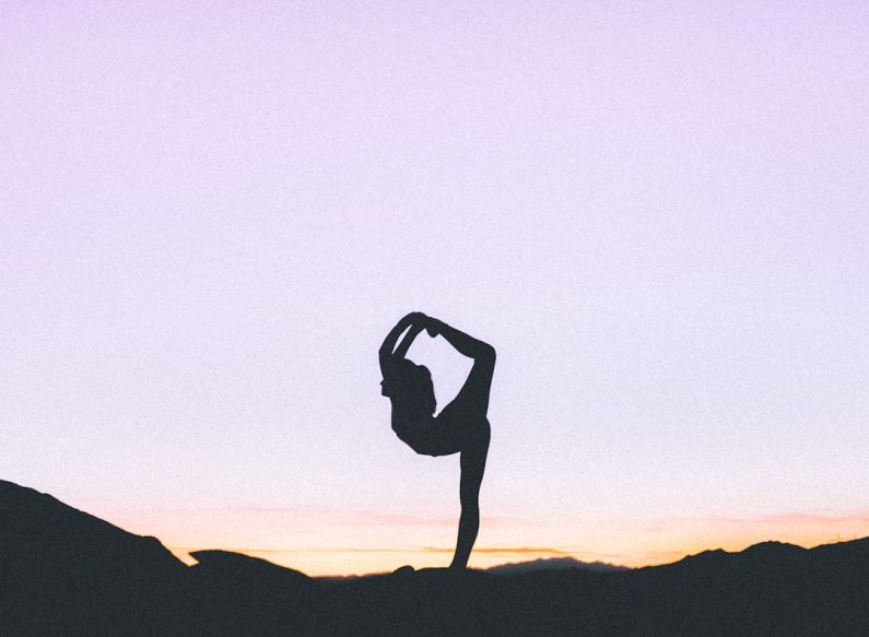Flexibility - woman standing with her one leg