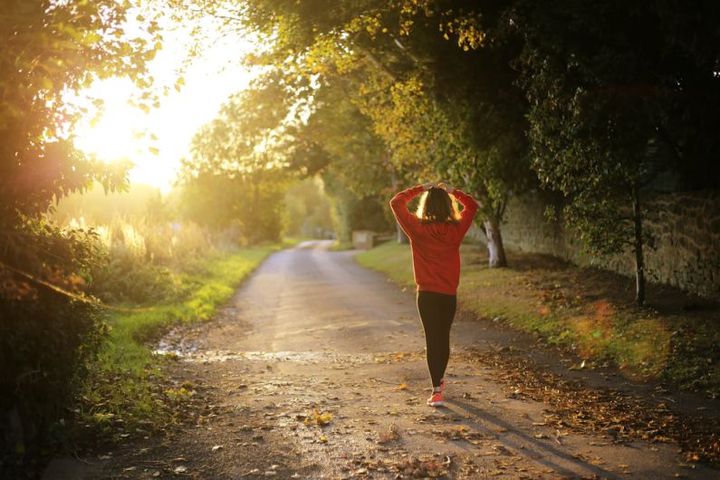 Health - woman walking on pathway during daytime