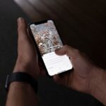 Mindfulness Apps - a person holding a cell phone in their hand
