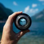 Focus - person holding camera lens