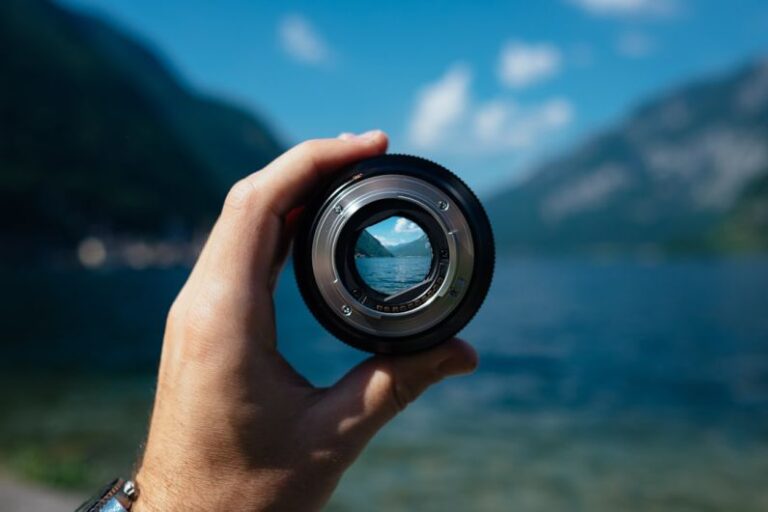 Focus - person holding camera lens