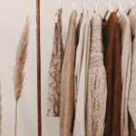 Wardrobe - hanged top on brown and white clothes horse