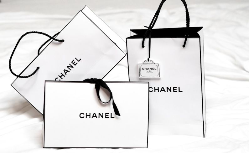 Fashion Brands - black framed sunglasses on white printer paper