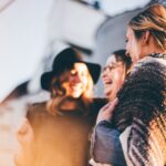 Moms - people laughing and talking outside during daytime